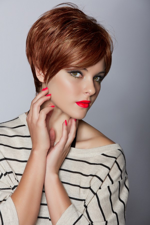 beautiful young woman with red hair wearing short pixie crop hai