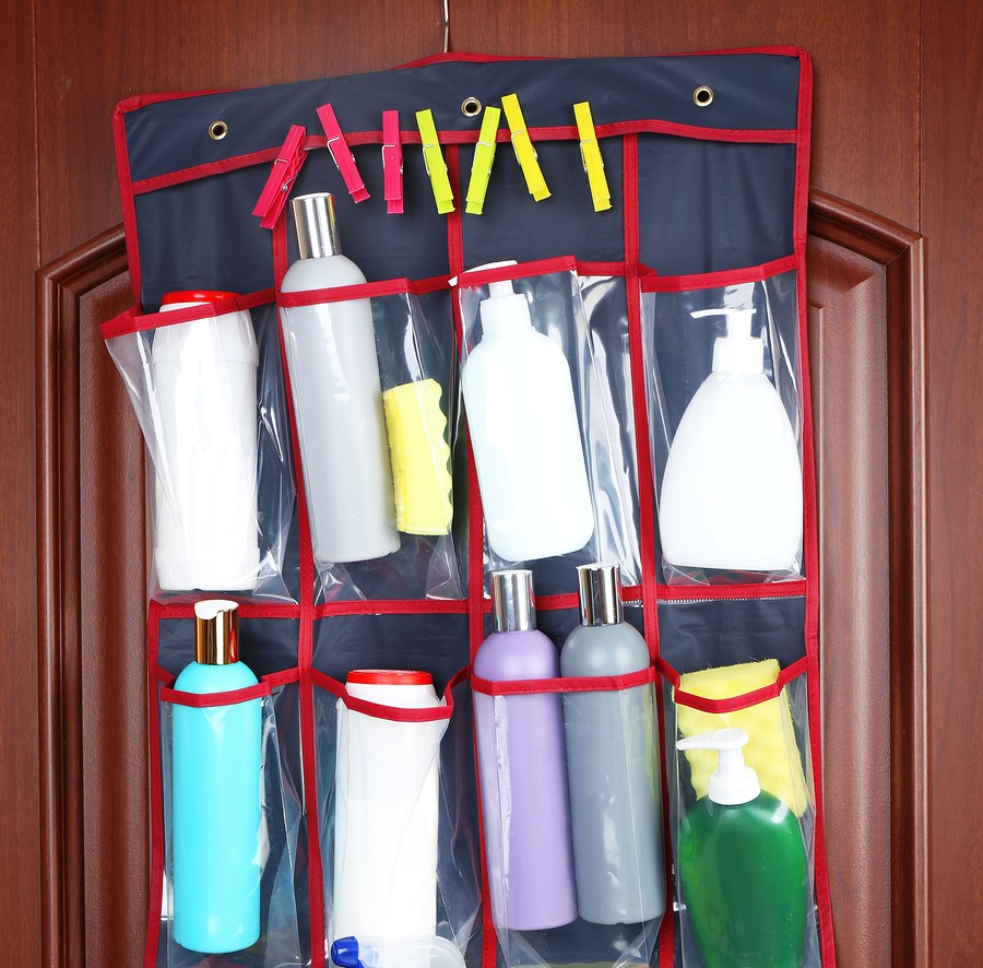 Different detergents in hanging bag wooden door