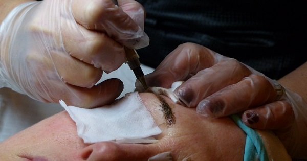 permanent makeup artist working