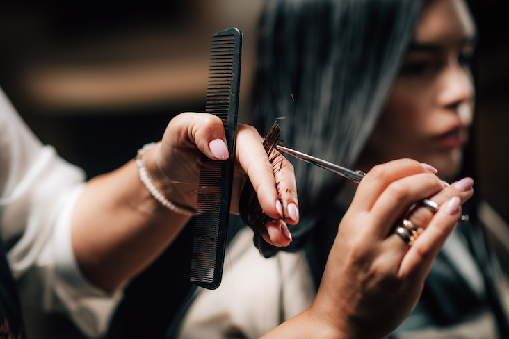 Using shears to trim hair