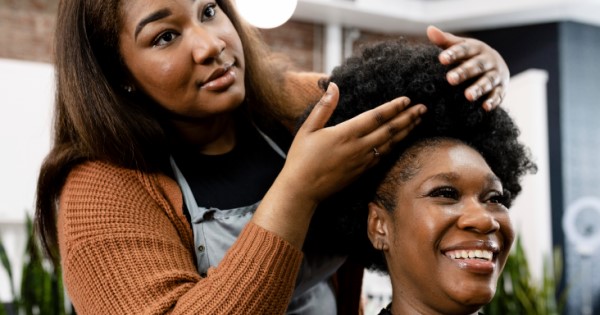 hairdresser preps clients hair