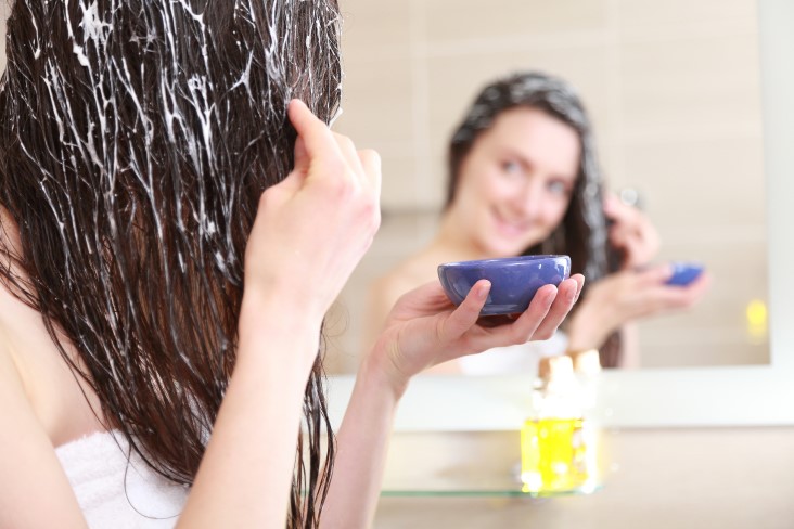 girl applying hair mask