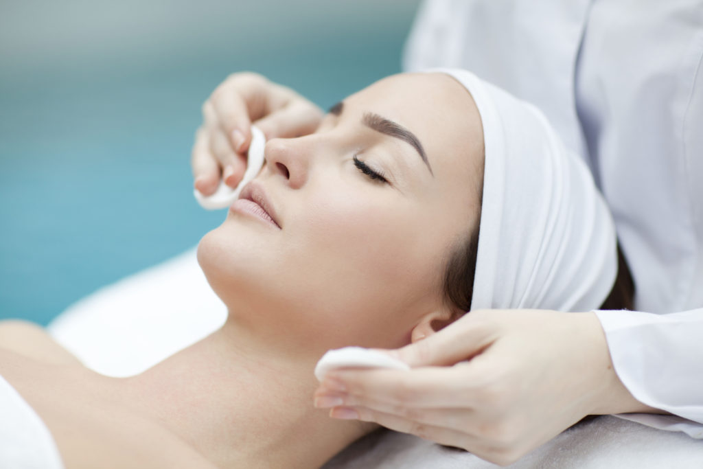 Esthetician giving skincare treatment