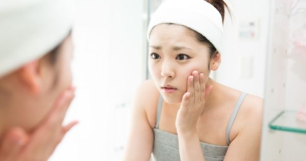 Woman worried about skin problems