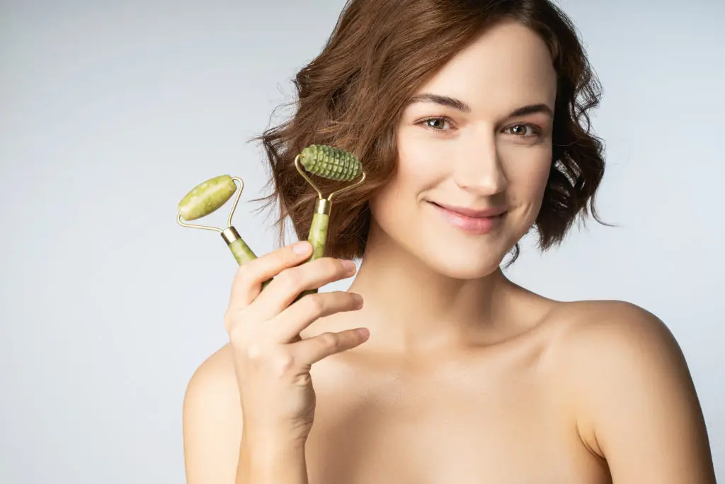 Woman holding jade rollers