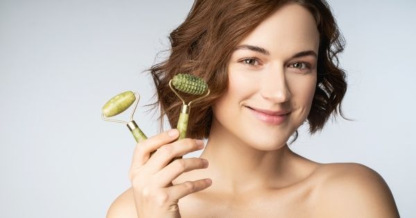 Woman holding jade rollers