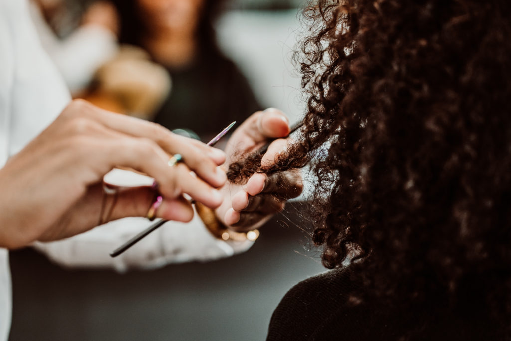 hairdresser working on textured hair