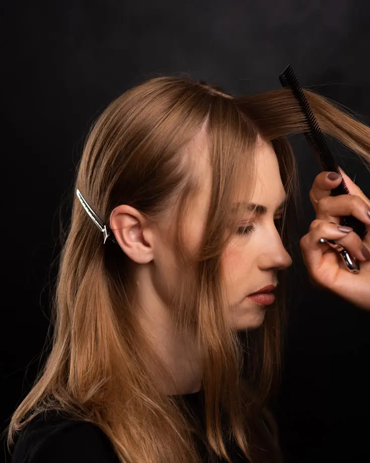 comb bangs to opposite side