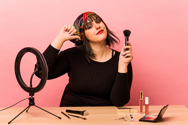 future beauty school student makes makeup tutorial for social media