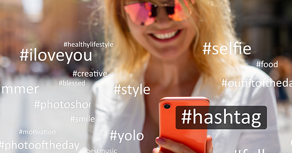 woman with lots of hashtags featured