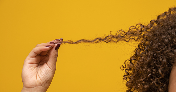 holding curly hair