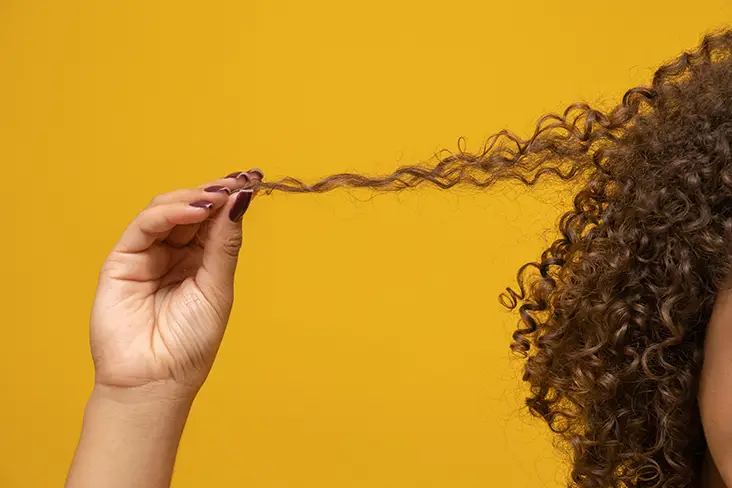 holding curly hair