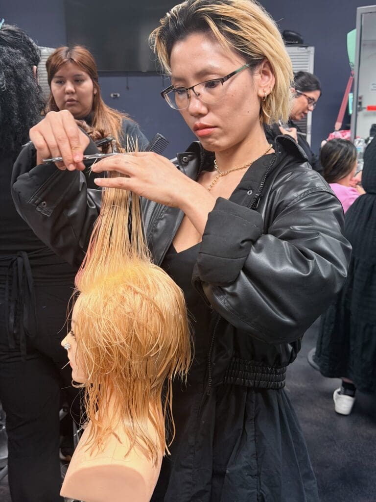 image of an ogle school cosmetology student training