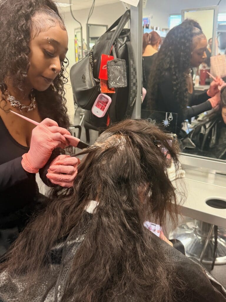 image of an ogle school cosmetology student training