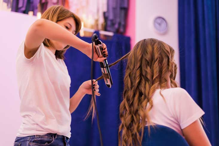 student curling hair