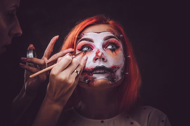 applying costume makeup