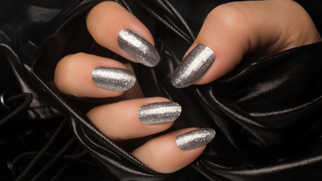 Picture of a hand with chrome metallic nails