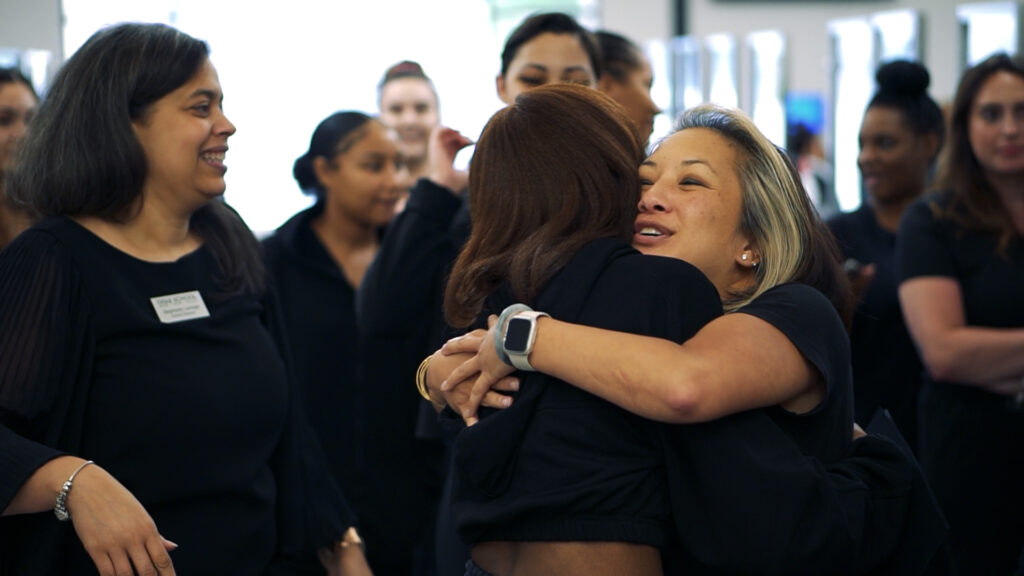 Picture of ogle school staff embracing ogle school student with a hug