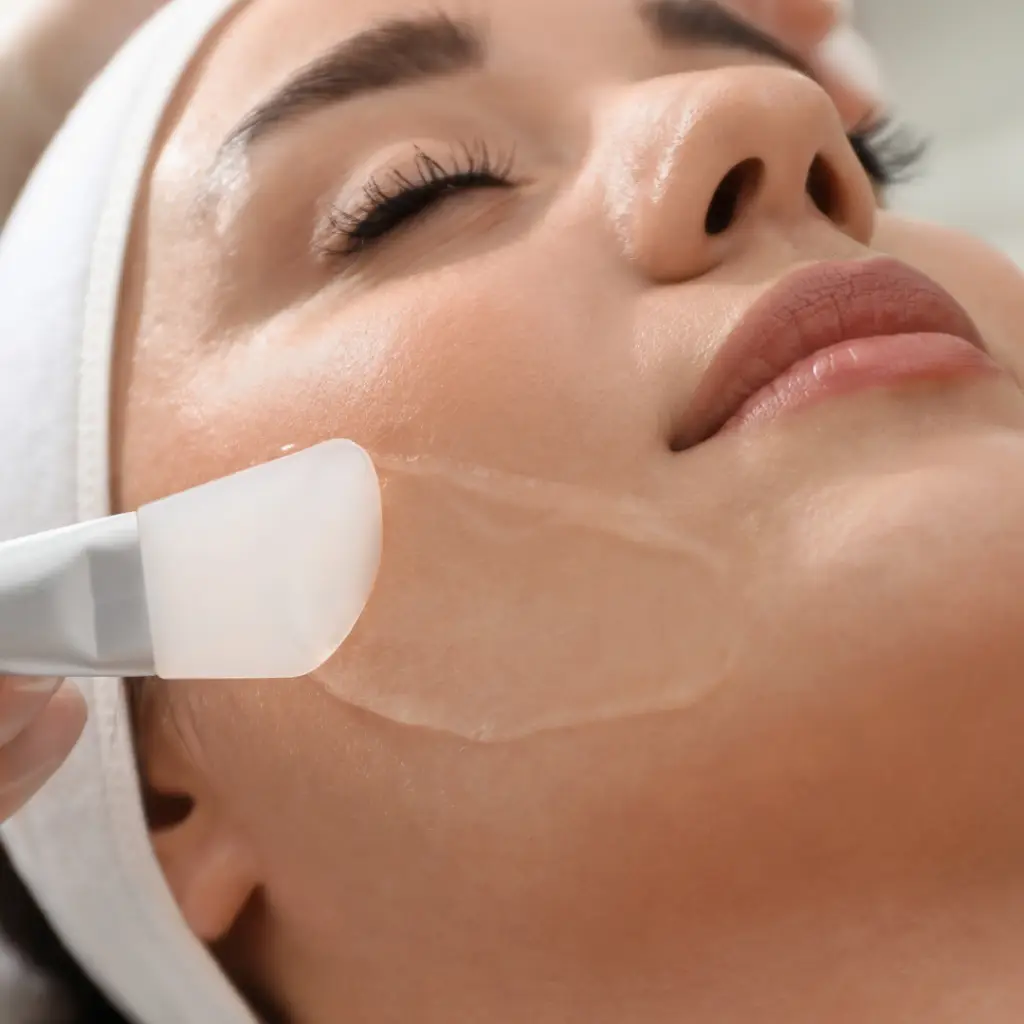 esthetics school in Dallas student skincare treatment being applied by brush