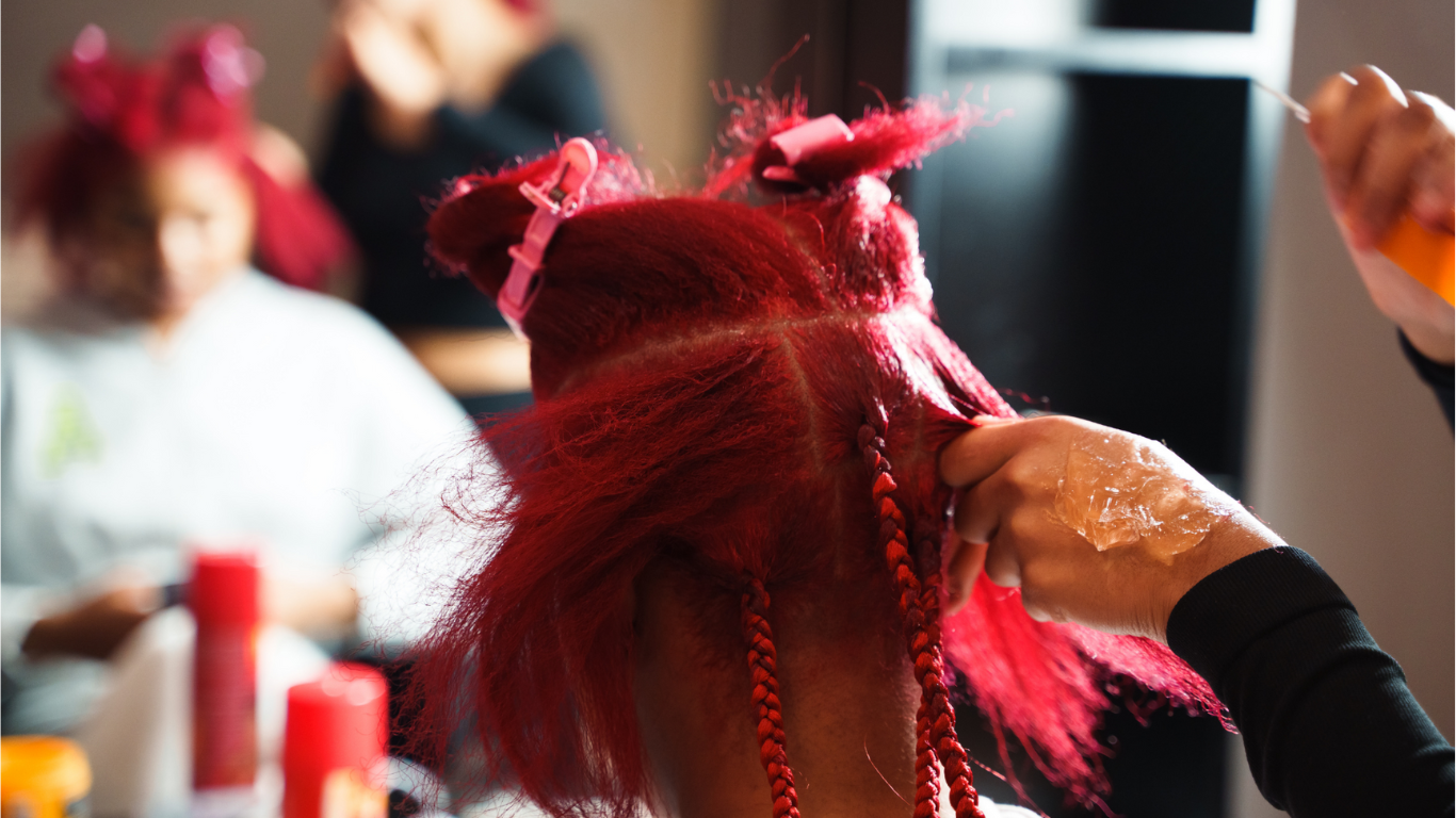Ogle beauty school in houston cosmetology student performing DIY hair trend beauty services