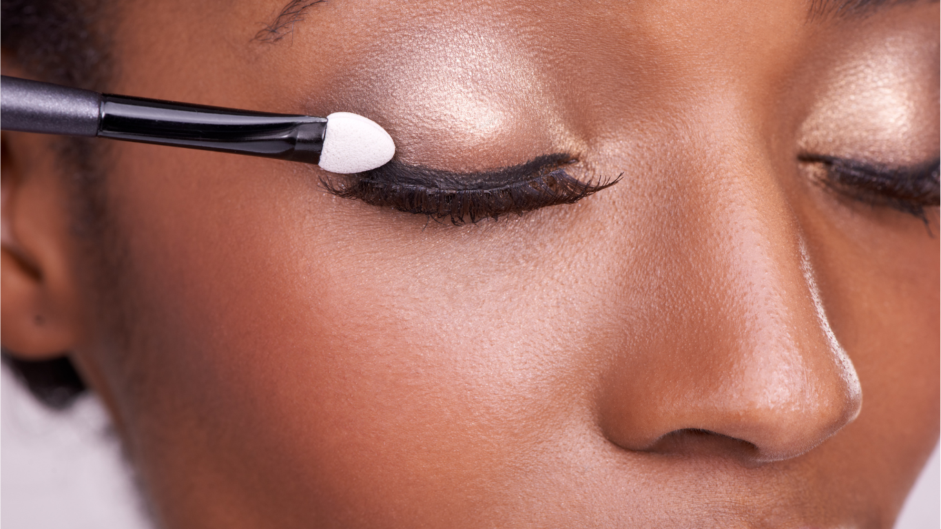Ogle school esthetics student applying makeup