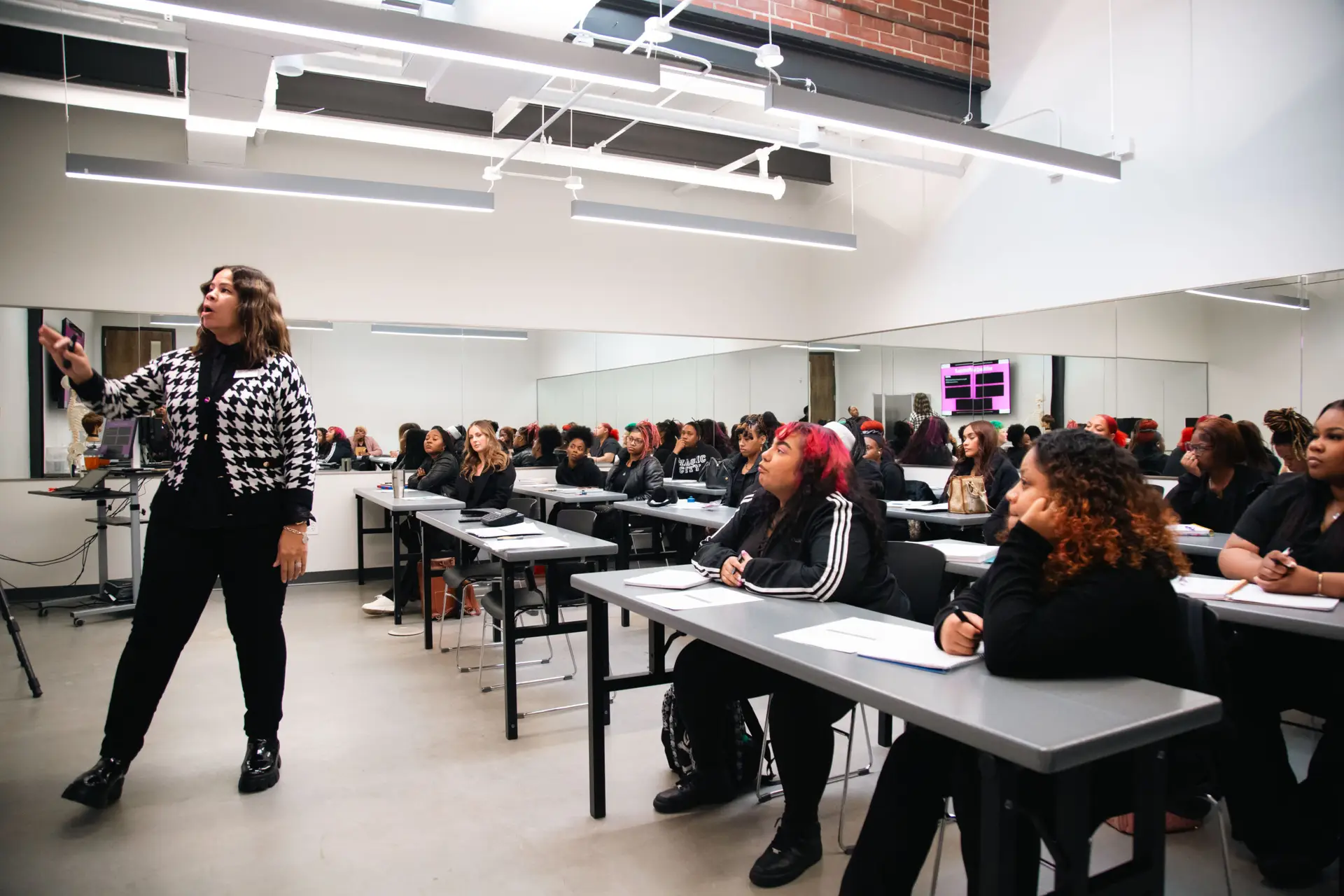 Ogle school instructor teaching the business side of beauty.