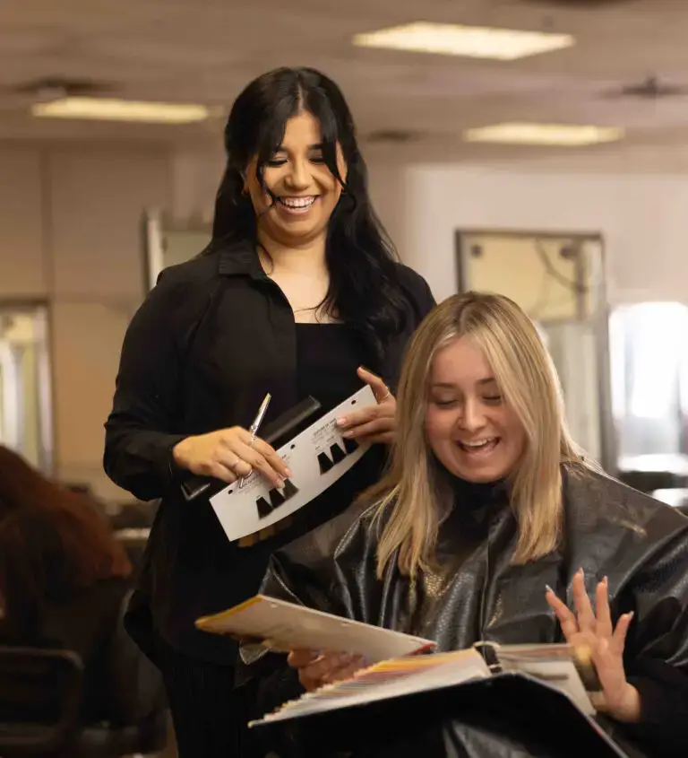 Ogle school cosmetology student performing hair service