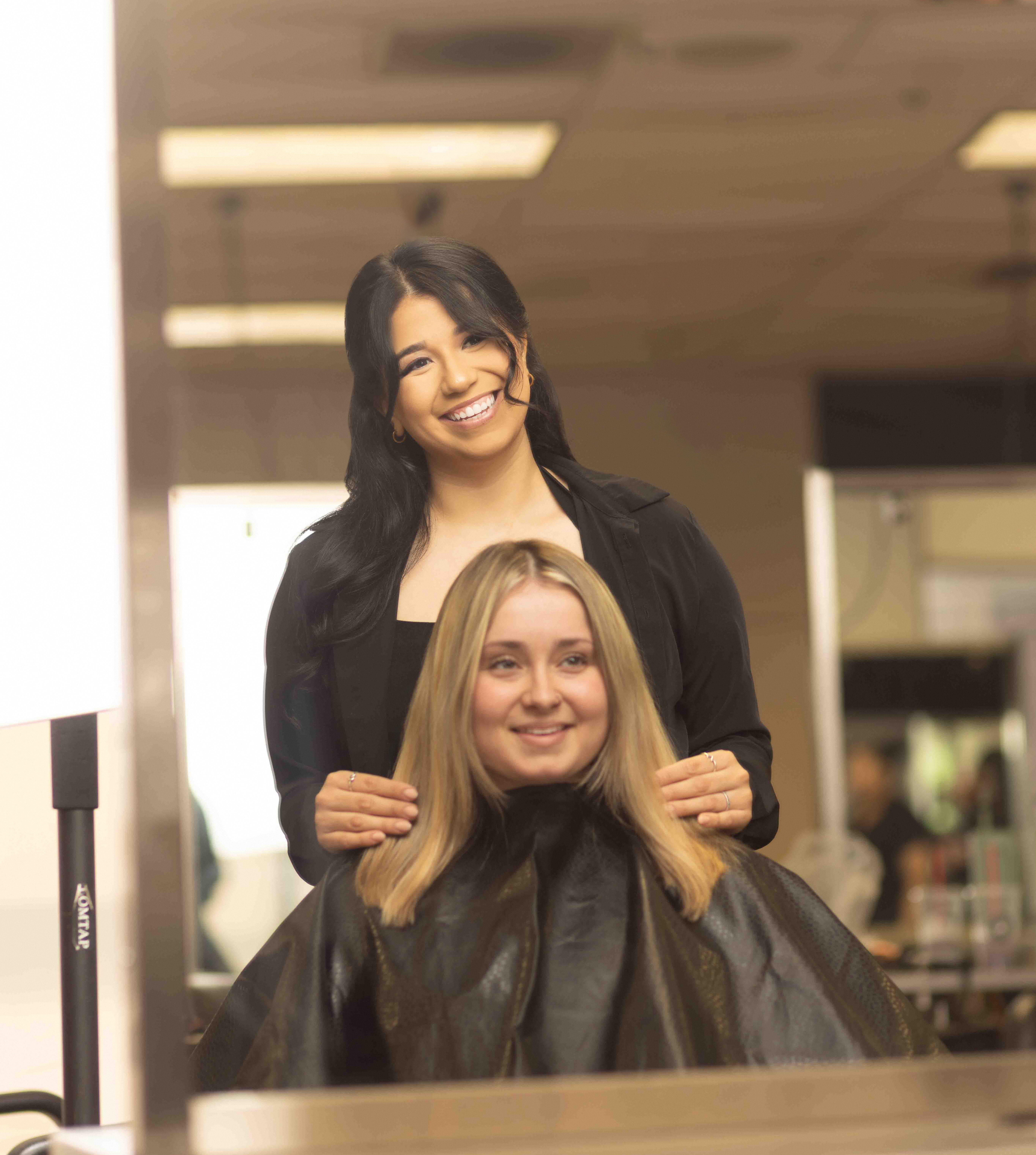 8B9A2344 Ogle school student providing hair services to a client