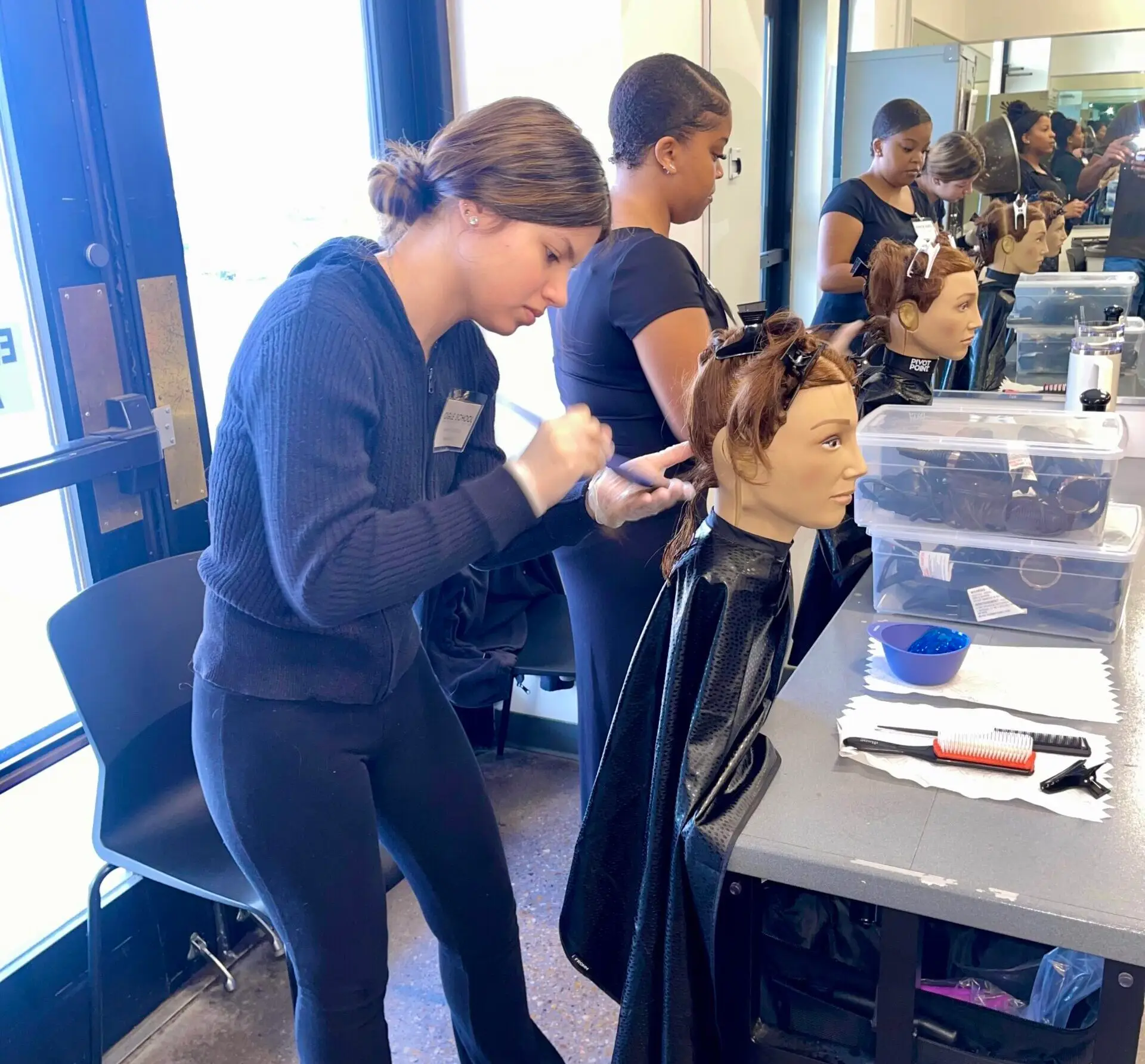 Image of an Ogle school student practicing hair care