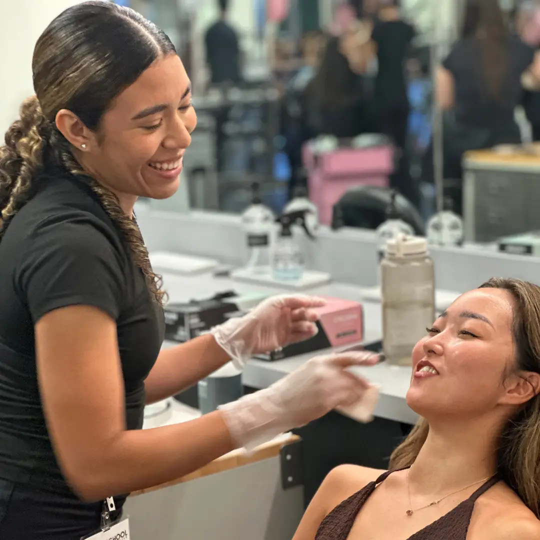 Image of Ogle school student performing facial on a client
