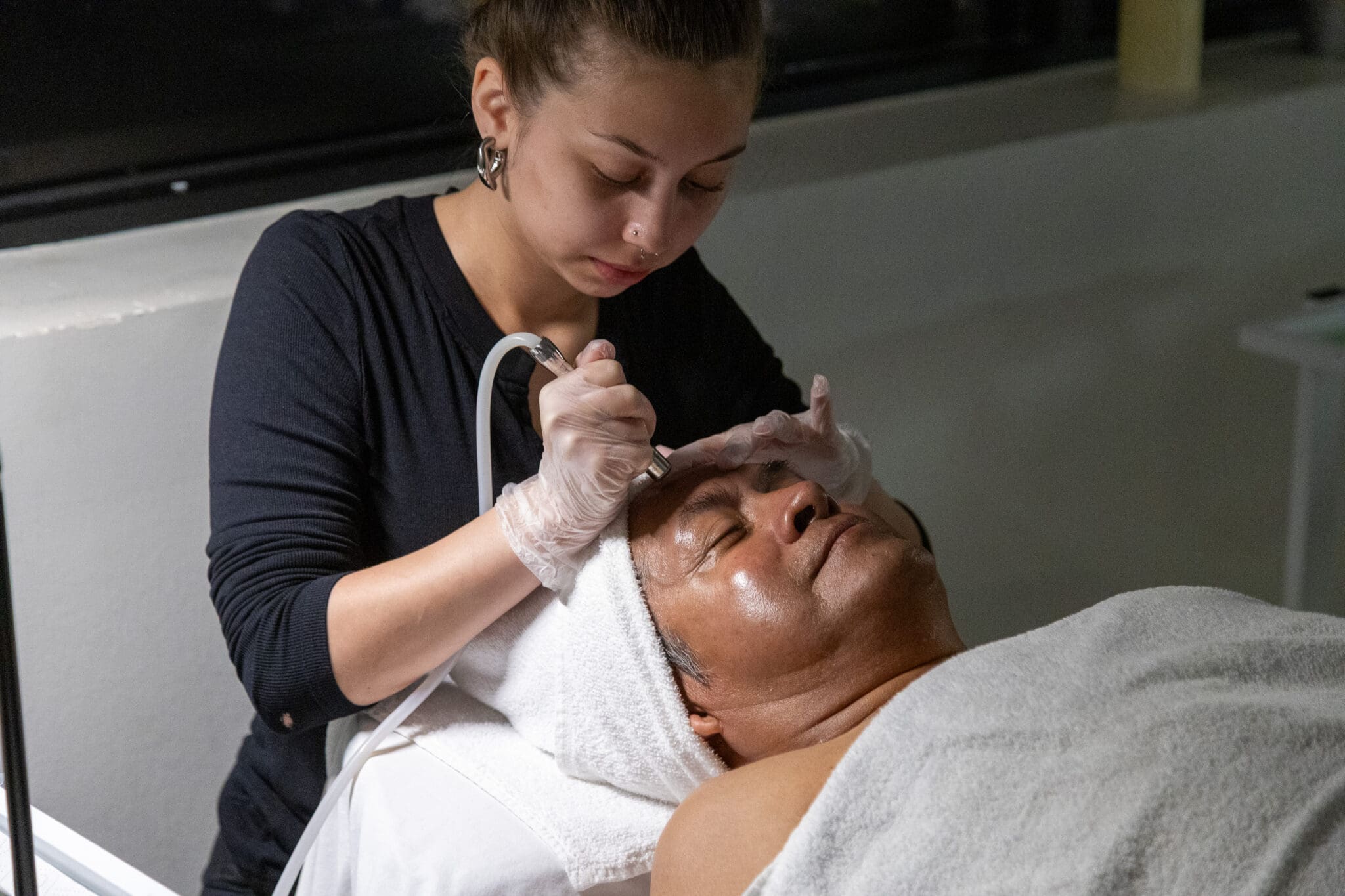 Image of Ogle School student performing a facial service